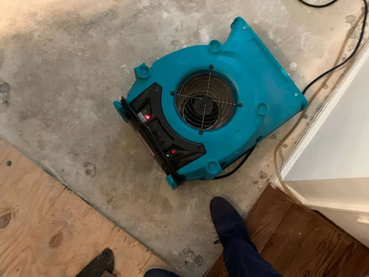 Air mover drying subfloor during Leak Detection & Repair in Yucaipa